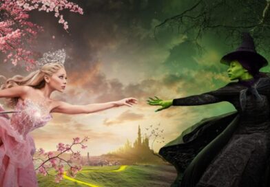 Glinda and Elphaba reach for each other (promotional image for Wicked Part 1)