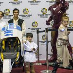 A Star Wars family complete with R2-D2 stroller!