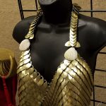 This costume, made in 2013 is a new take on DC Comic's first appearance of Aqua Girl. Ottilie Murray's costume weighs 9 lbs and was designed to be able to get wet.