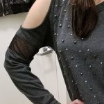 One of the largest cold-shoulder openings I've seen on a sweater, with added netting maybe for extra cold