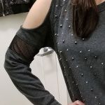 One of the largest cold-shoulder openings I've seen on a sweater, with added netting maybe for extra cold